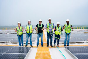 Solar EPC company team reviewing rooftop installation plans India
